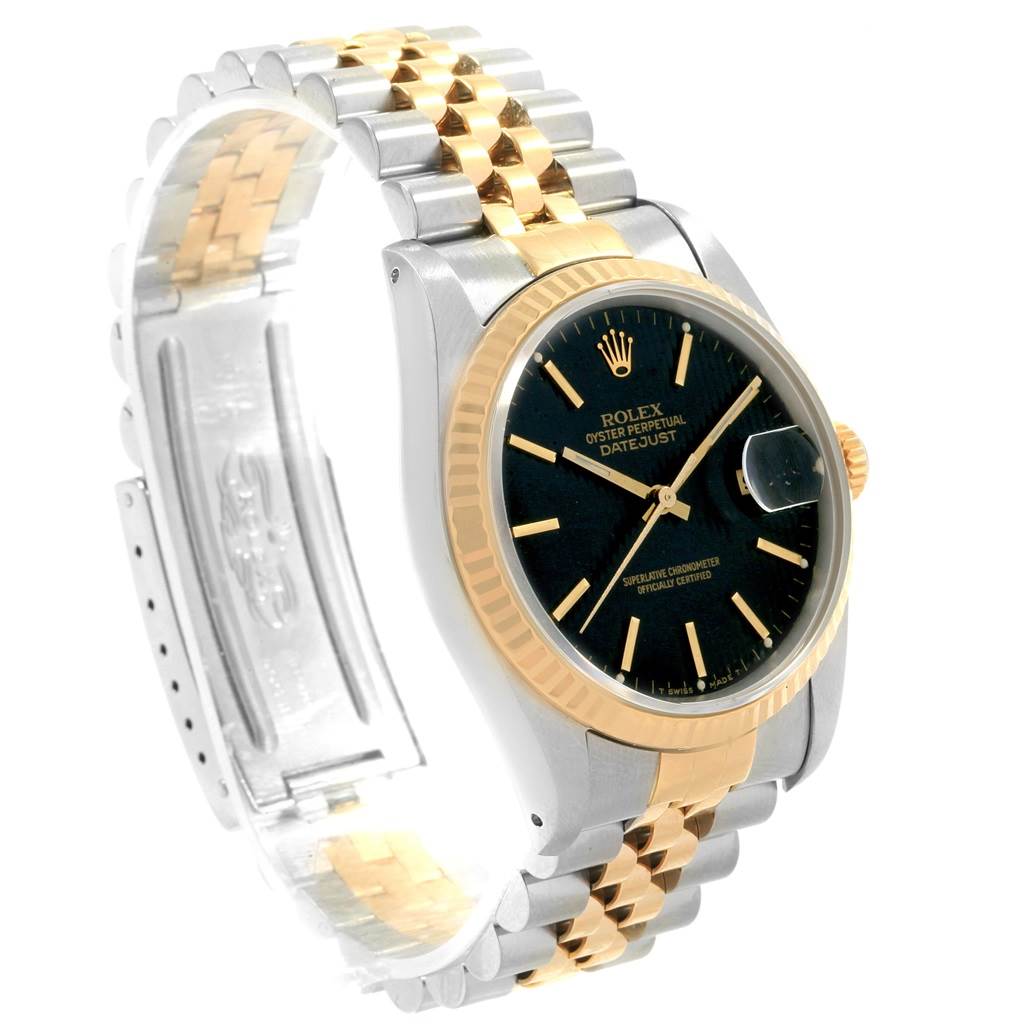 This image shows a side view of a Rolex Datejust 16233 Men's Steel and Gold (two tone) Black Dial 16233 Men's Steel and Gold (two tone) Black Dial watch, highlighting its two-tone metal bracelet, black dial, and fluted bezel.
