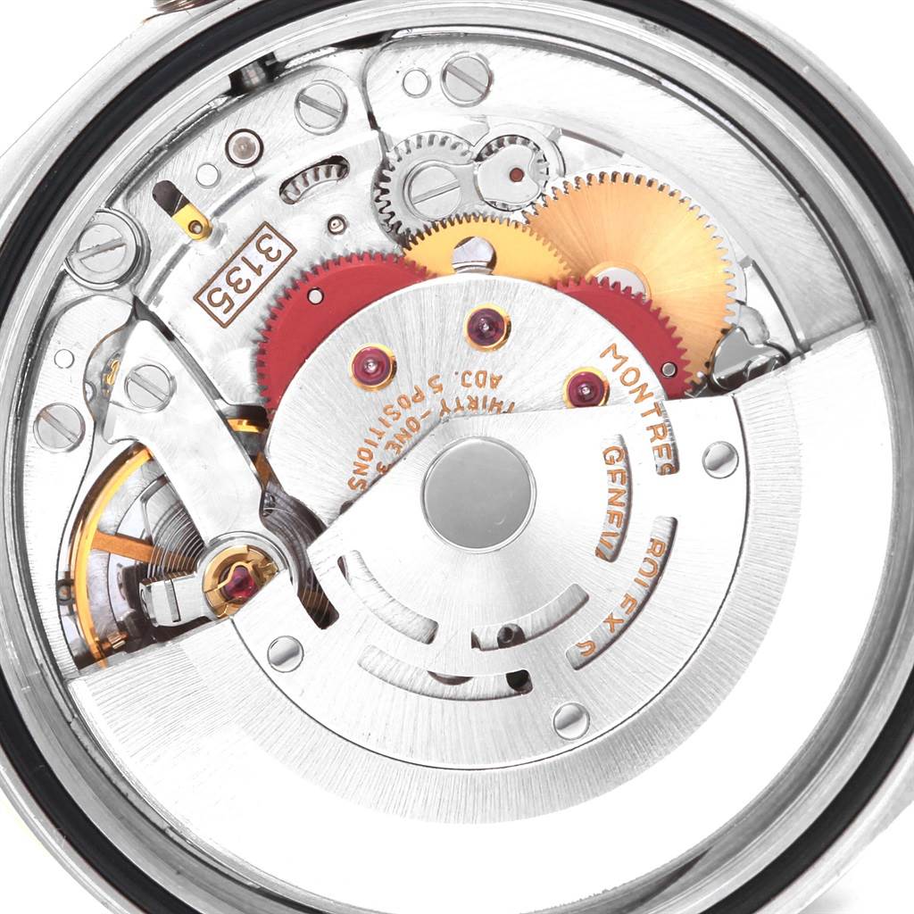 The image shows the intricate inner mechanism of a Rolex Datejust 16233 Men's Steel and Gold (two tone) Black Dial 16233 Men's Steel and Gold (two tone) Black Dial watch, viewed from the back.