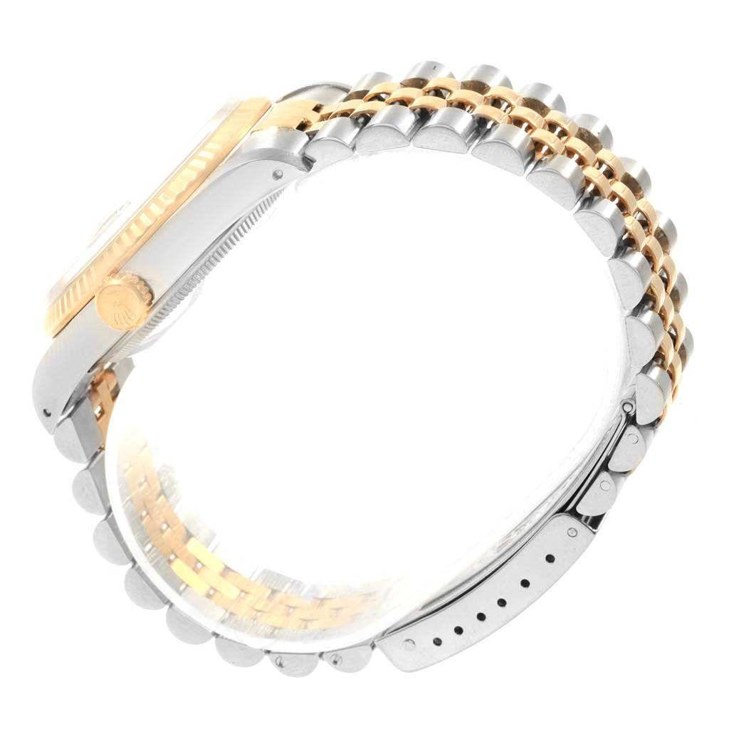 The image shows a side view of a Rolex Datejust 16233 Men's Steel and Gold (two tone) Black Dial 16233 Men's Steel and Gold (two tone) Black Dial watch, highlighting its two-tone case, bezel, and jubilee bracelet.