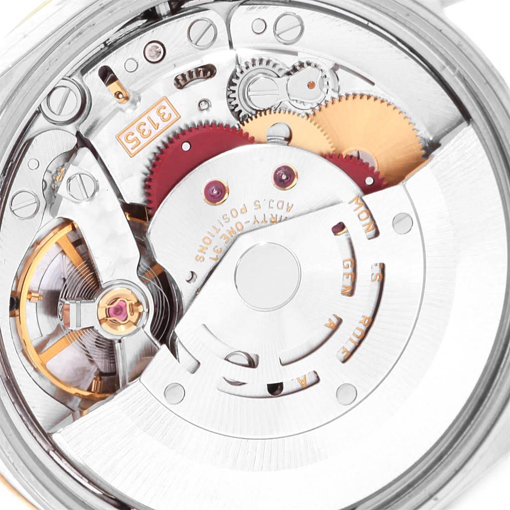 This image shows the intricate movement and gears of a Rolex Datejust 15203 Men's Steel and Gold (two tone) White Dial 15203 Men's Steel and Gold (two tone) White Dial watch from a rear, close-up angle.