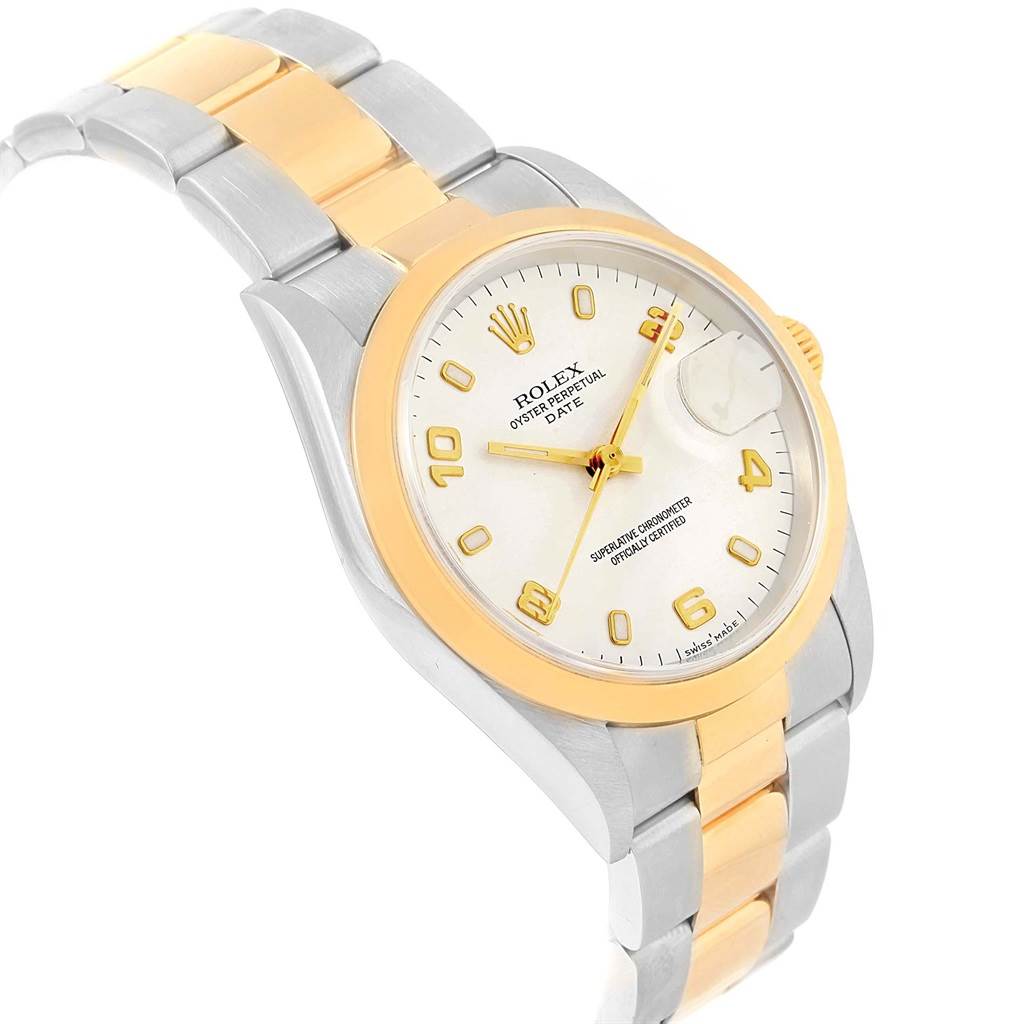 This image shows a Rolex Datejust 15203 Men's Steel and Gold (two tone) White Dial 15203 Men's Steel and Gold (two tone) White Dial watch at a slight angle, featuring its gold and silver bracelet and dial.