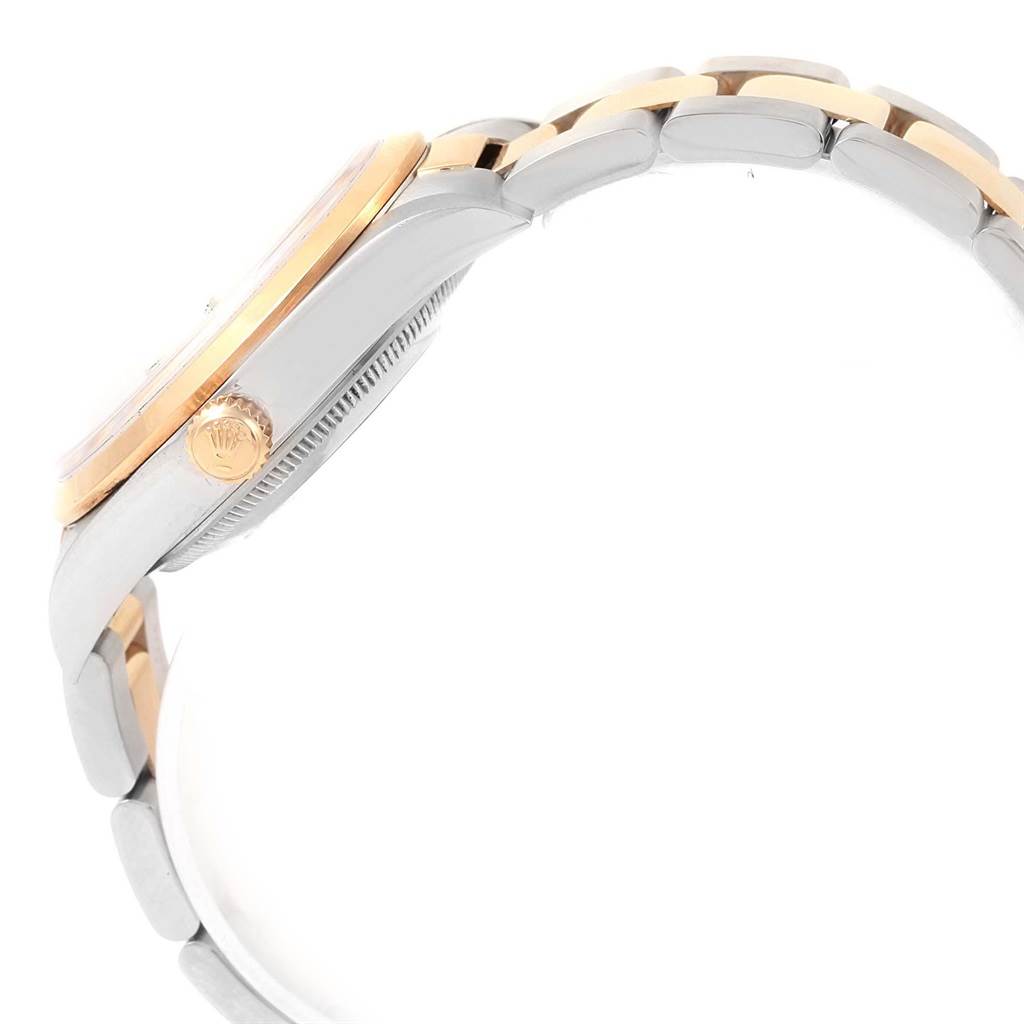 This image shows a side view of a Rolex Datejust 15203 Men's Steel and Gold (two tone) White Dial 15203 Men's Steel and Gold (two tone) White Dial watch, highlighting the bezel, crown, and part of the bracelet.