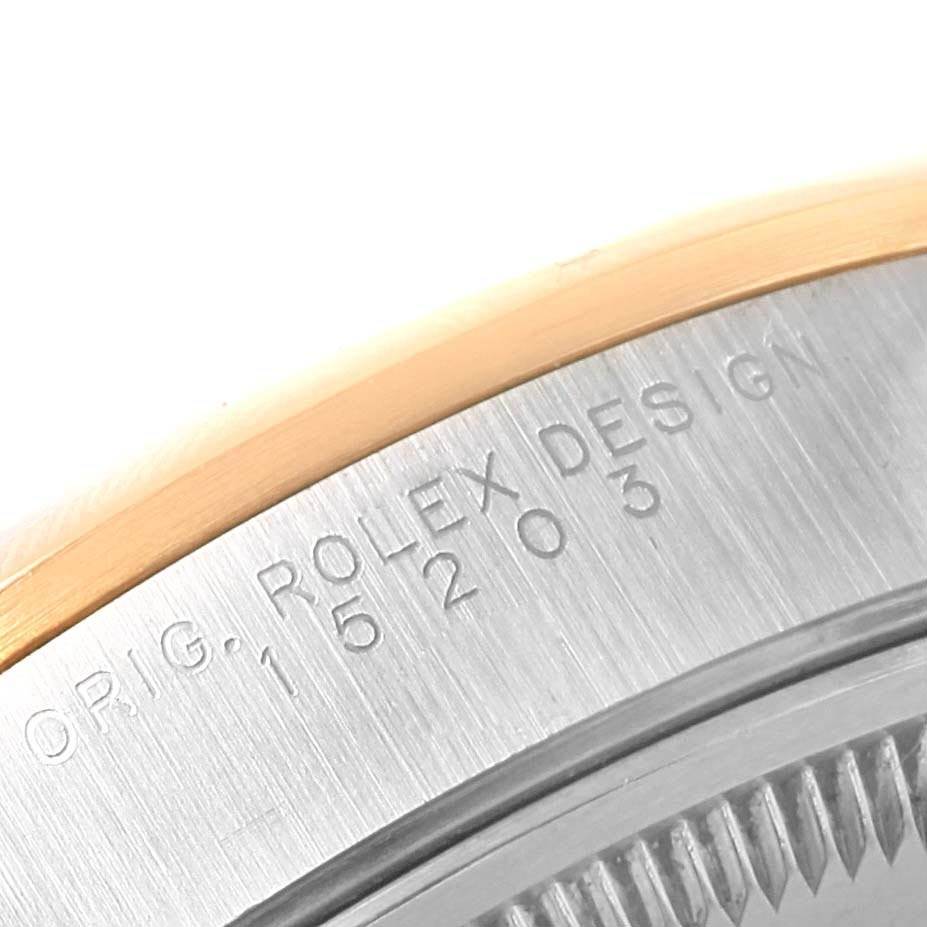 This image shows a close-up of the case back and edge of the bezel of a Rolex Datejust 15203 Men's Steel and Gold (two tone) White Dial 15203 Men's Steel and Gold (two tone) White Dial.