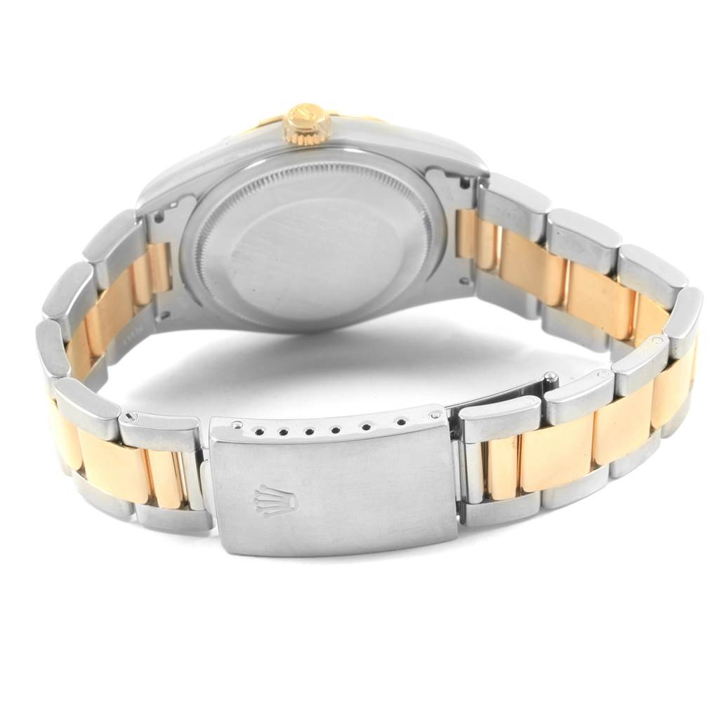 The image shows the back view of a Rolex Datejust 16203 Men's Steel and Gold (two tone) Grey Dial 16203 Men's Steel and Gold (two tone) Grey Dial watch, highlighting its case back and bicolor bracelet with a clasp.