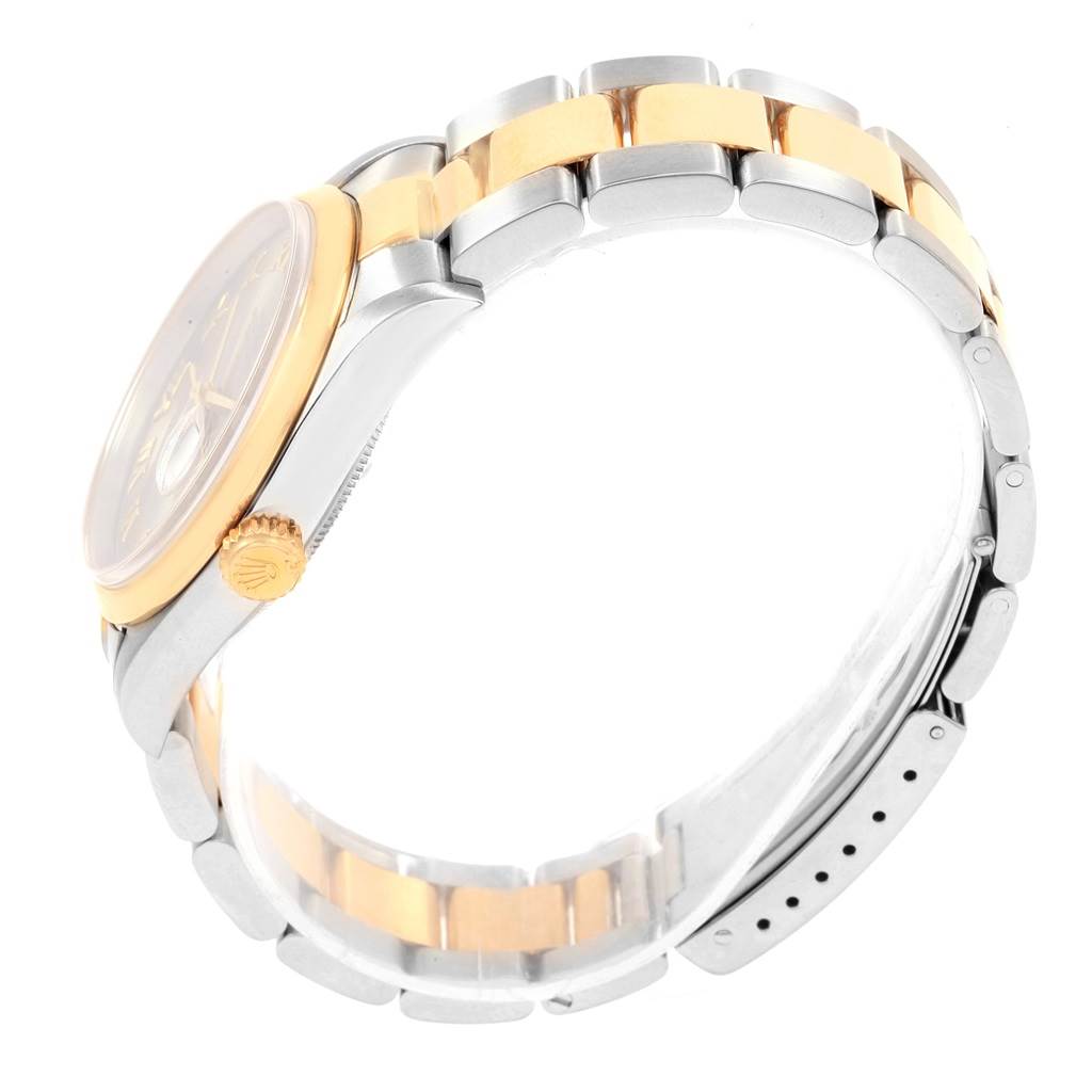 The image shows a side view of the Rolex Datejust 16203 Men's Steel and Gold (two tone) Grey Dial 16203 Men's Steel and Gold (two tone) Grey Dial, highlighting the crown, bezel, and two-tone bracelet.