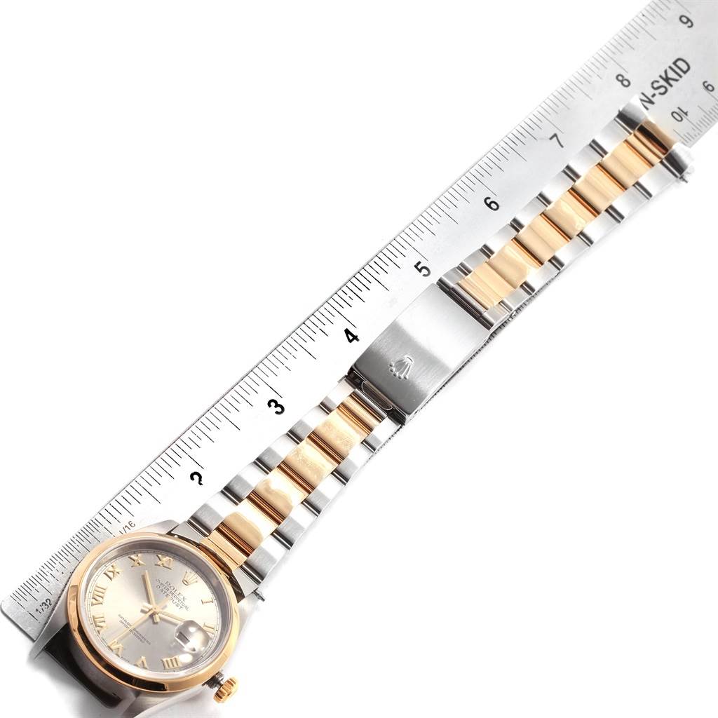 The image shows a two-tone bracelet and clasp of a Rolex Datejust 16203 Men's Steel and Gold (two tone) Grey Dial 16203 Men's Steel and Gold (two tone) Grey Dial watch, laid next to a ruler for measurement.