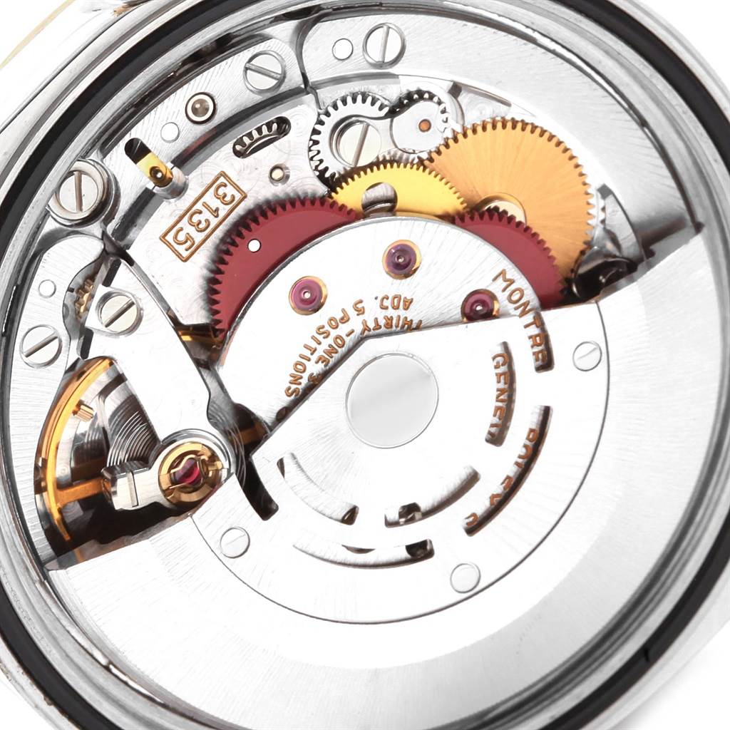This image shows the intricate internal movement components of the Rolex Datejust 16233 Men's Steel and Gold (two tone) Champagne Dial 16233 Men's Steel and Gold (two tone) Champagne Dial watch from a close-up angle.