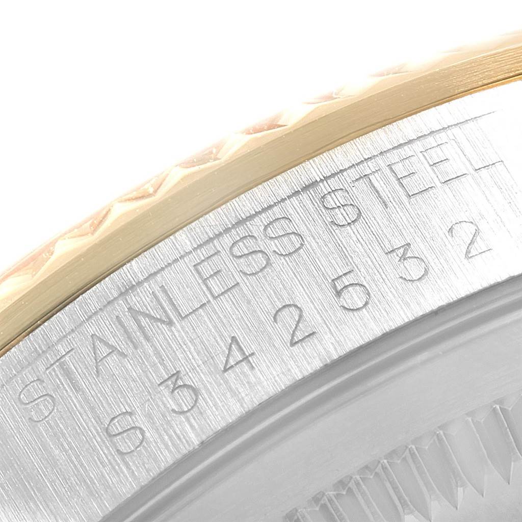 The image shows a close-up of the engraved stainless steel case back of a Rolex Datejust 16233 Men's Steel and Gold (two tone) White Dial 16233 Men's Steel and Gold (two tone) White Dial watch.