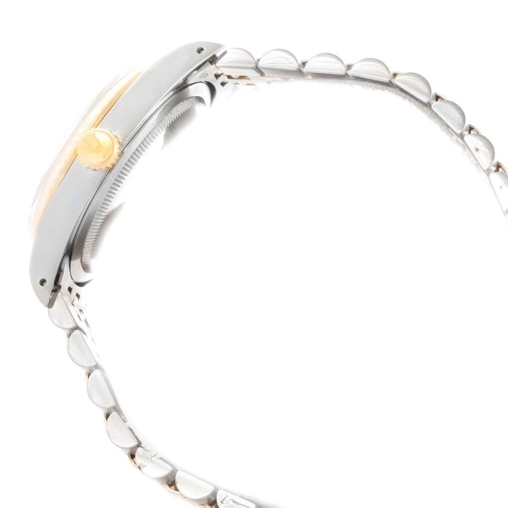 This image shows a side angle of the Rolex Datejust 16233 Men's Steel and Gold (two tone) White Dial 16233 Men's Steel and Gold (two tone) White Dial watch, highlighting its crown and part of the bracelet.