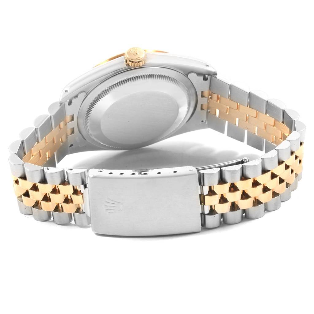 The image shows the back view of a Rolex Datejust 16233 Men's Steel and Gold (two tone) White Dial 16233 Men's Steel and Gold (two tone) White Dial watch, highlighting the case back and jubilee bracelet with a clasp.