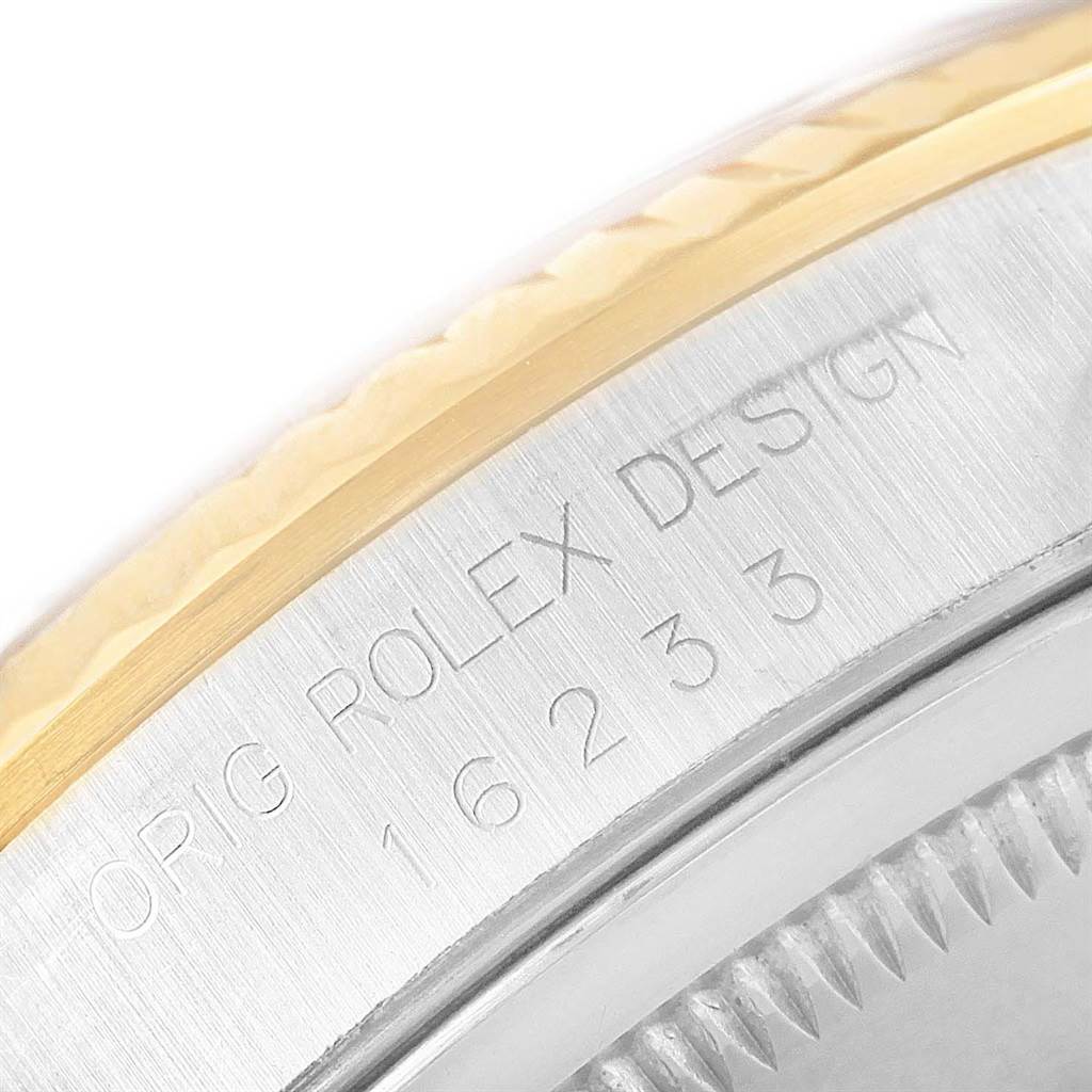 This is a close-up view of the bezel and the engraved model number of a Rolex Datejust 16233 Men's Steel and Gold (two tone) Champagne Dial 16233 Men's Steel and Gold (two tone) Champagne Dial.