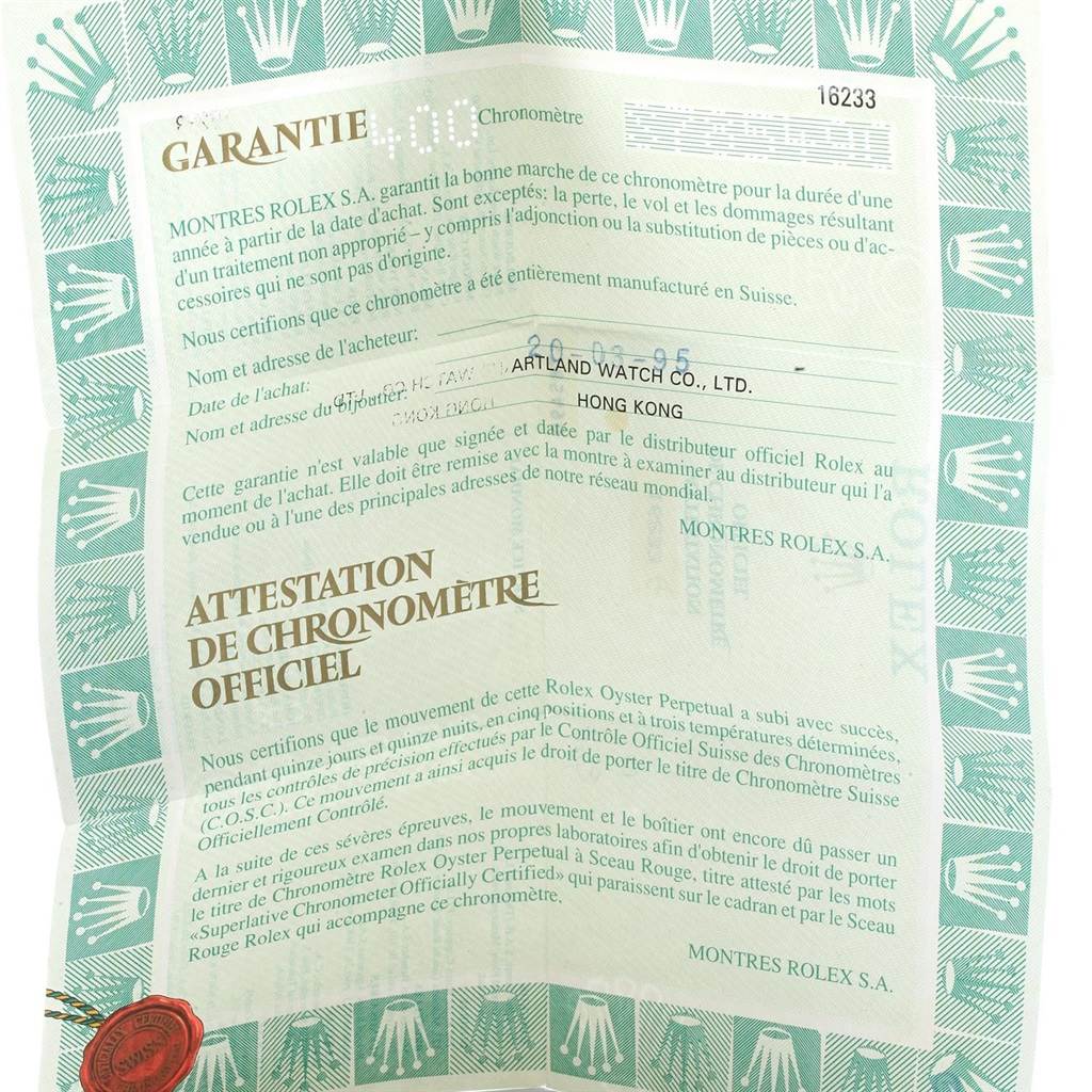 The image shows a close-up of the warranty certificate for the Rolex Datejust 16233 Men's Steel and Gold (two tone) Champagne Dial 16233 Men's Steel and Gold (two tone) Champagne Dial watch.