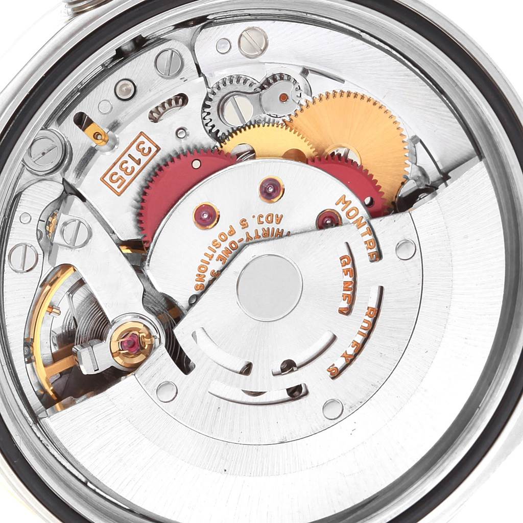 This image shows a close-up of the movement mechanism of a Rolex Datejust 16233 Men's Steel and Gold (two tone) Black Dial 16233 Men's Steel and Gold (two tone) Black Dial watch.
