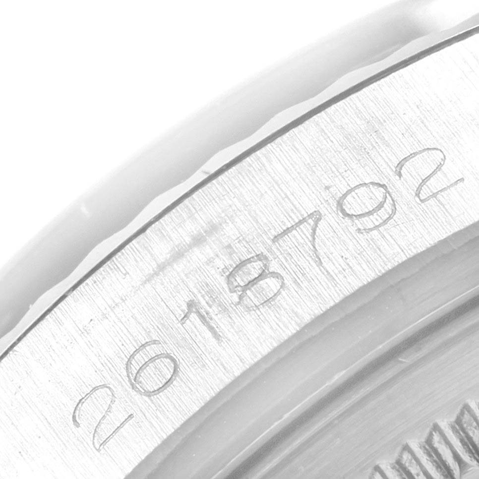 This image shows the engraved serial number on the bezel of a Rolex Datejust 1601 Men
s Stainless Steel Silver Dial 1601 Men
s Stainless Steel Silver Dial watch, viewed up close.