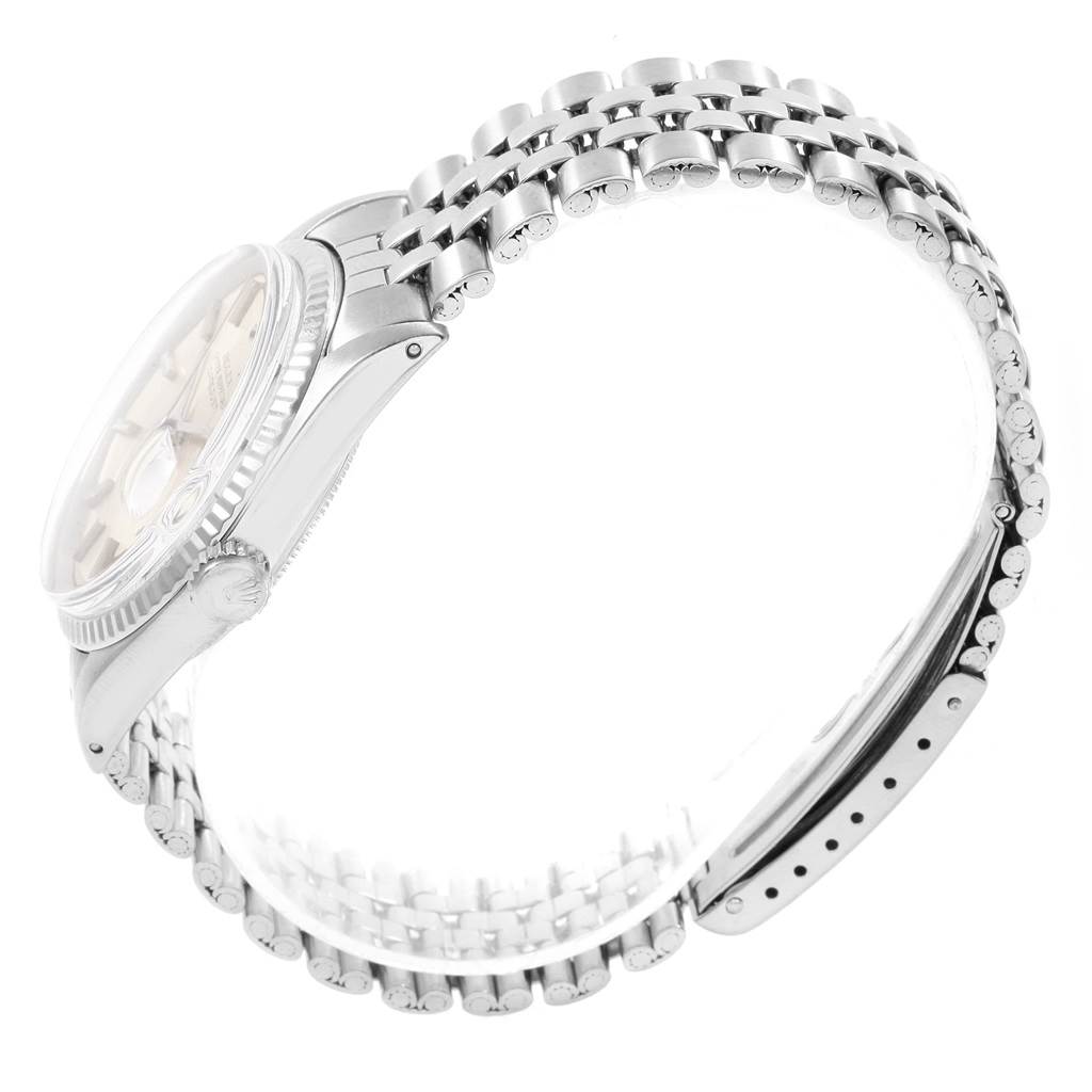 The image shows a Rolex Datejust 1601 Men
s Stainless Steel Silver Dial 1601 Men
s Stainless Steel Silver Dial watch from a side angle, highlighting its bracelet and partially visible dial.