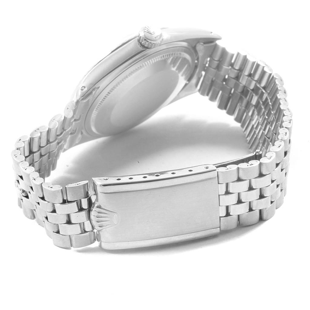 The image shows the back case, crown, and Jubilee bracelet clasp of a Rolex Datejust 1601 Men
s Stainless Steel Silver Dial 1601 Men
s Stainless Steel Silver Dial watch.