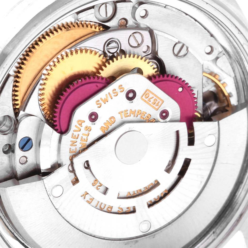The close-up angle shows the intricate internal mechanical components of the Rolex Datejust 1601 Men
s Stainless Steel Silver Dial 1601 Men
s Stainless Steel Silver Dial watch movement.
