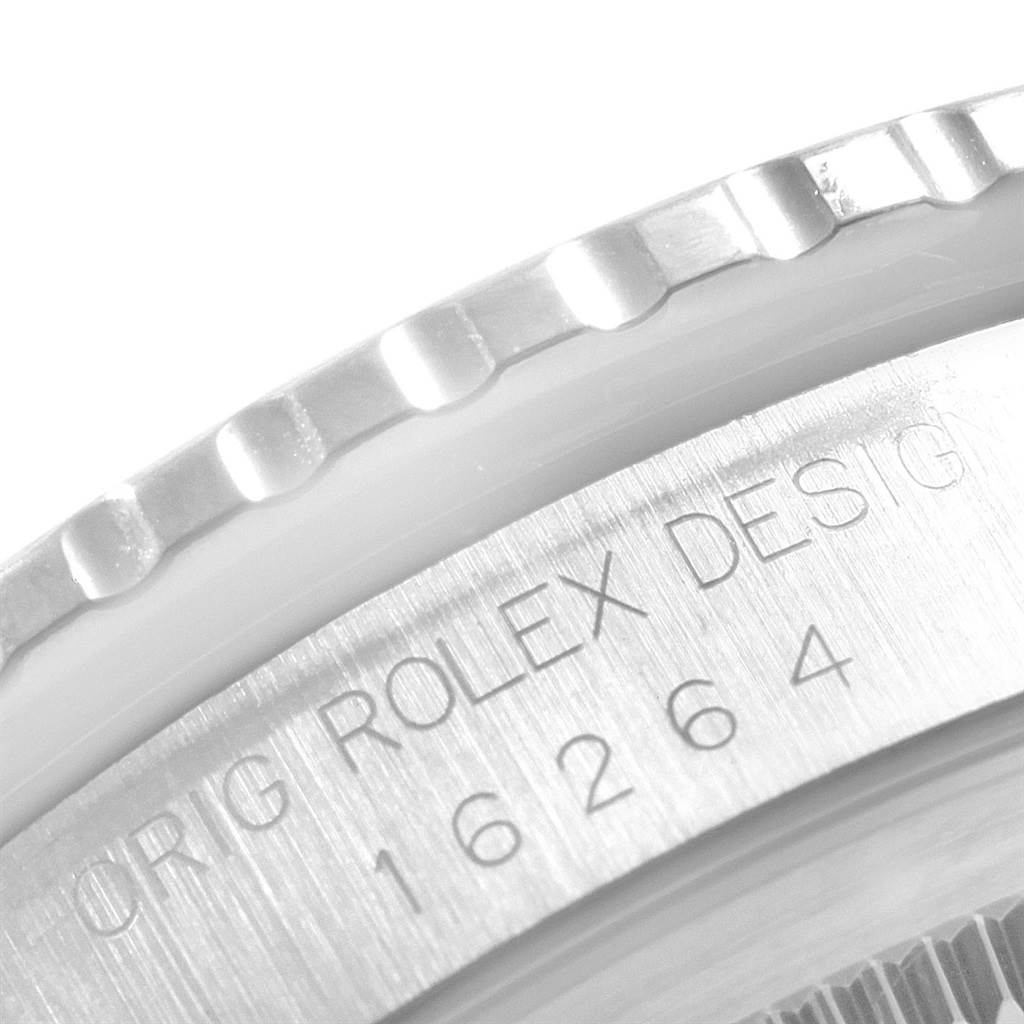 This close-up image shows the engraved bezel and part of the casing of a Rolex Datejust 16264 Men's Stainless Steel Silver Dial 16264 Men's Stainless Steel Silver Dial watch.