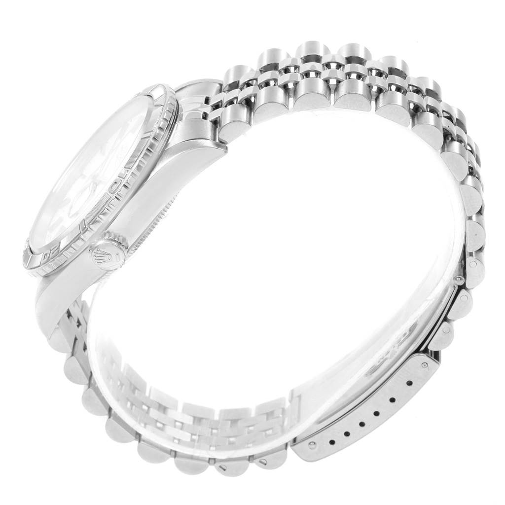 The image shows a side view of a Rolex Datejust 16264 Men's Stainless Steel Silver Dial 16264 Men's Stainless Steel Silver Dial watch, highlighting its bracelet and crown details.