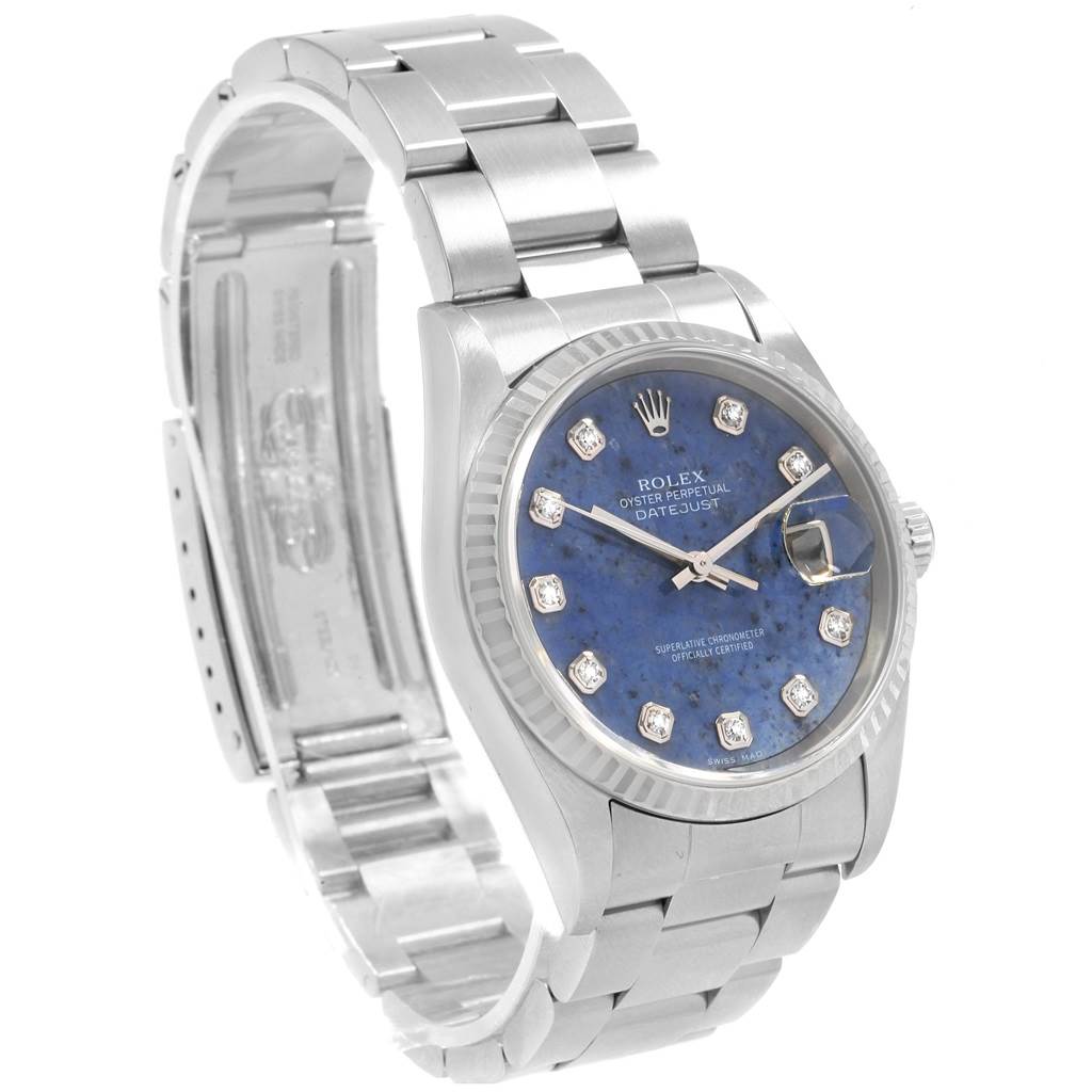 This image shows the Rolex Datejust 16234 Men
s Stainless Steel Blue Dial 16234 Men
s Stainless Steel Blue Dial watch at a three-quarter angle, highlighting its face, dial, and stainless steel bracelet.