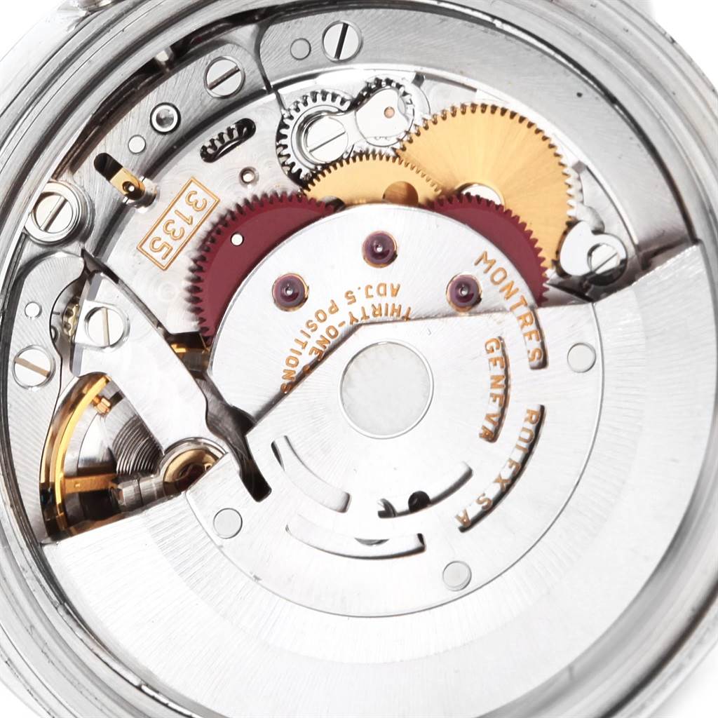 This close-up image shows the intricate inner mechanism and gears of a Rolex Datejust 16234 Men
s Stainless Steel Blue Dial 16234 Men
s Stainless Steel Blue Dial watch.