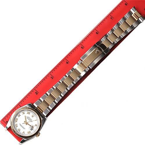 The image shows a Rolex Datejust 116233-WRJ Men's Stainless Steel White Dial 116233-WRJ Men's Stainless Steel White Dial watch laid flat with its band extended alongside a red ruler for measurement.