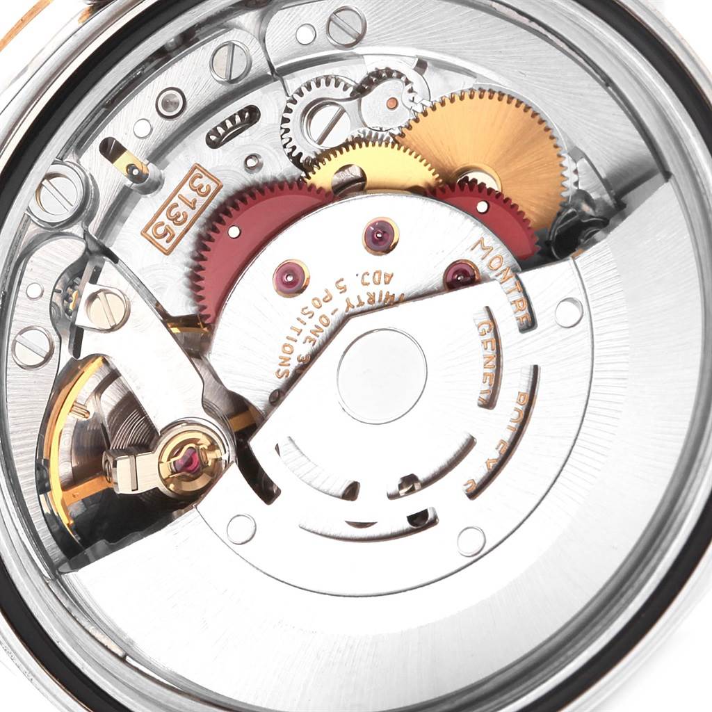 This image shows the intricate internal movement and gears of a Rolex Datejust 16233 Men's Steel and Gold (two tone) White Dial 16233 Men's Steel and Gold (two tone) White Dial watch.