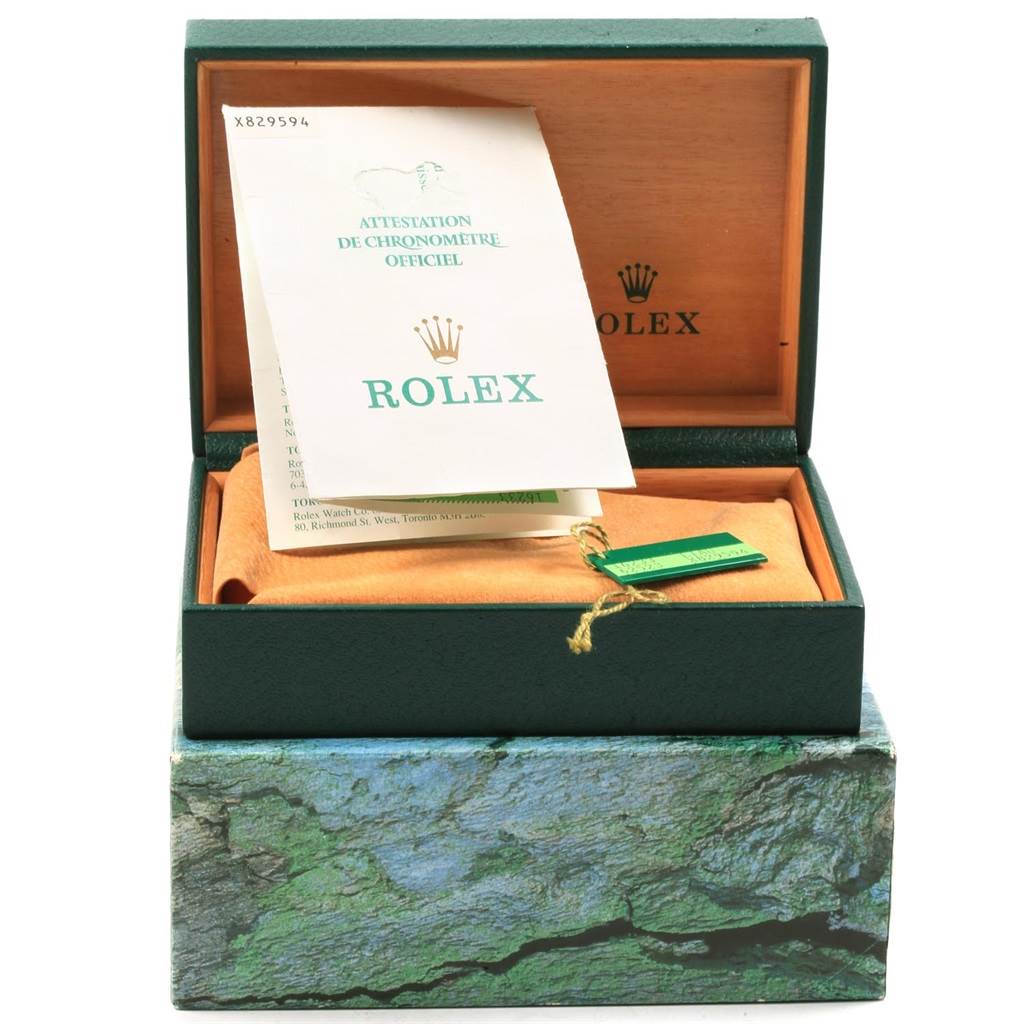 The image shows a Rolex Datejust 16233 Men's Steel and Gold (two tone) White Dial 16233 Men's Steel and Gold (two tone) White Dial watch box, an official chronometer certificate, and a green tag inside an open box.