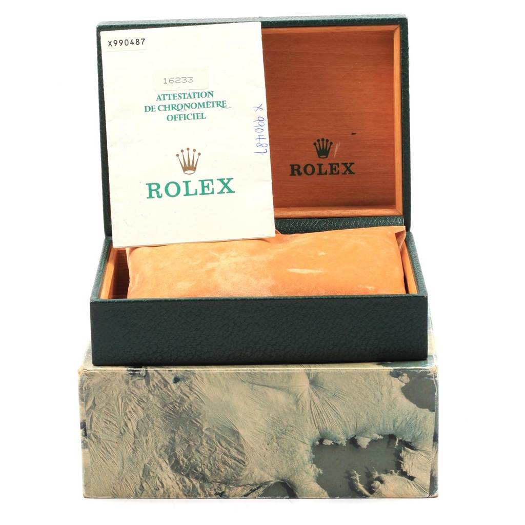 The image shows an open Rolex Datejust 16233 Men's Steel and Gold (two tone) Champagne Dial 16233 Men's Steel and Gold (two tone) Champagne Dial box with its lid upright, displaying official documentation inside.