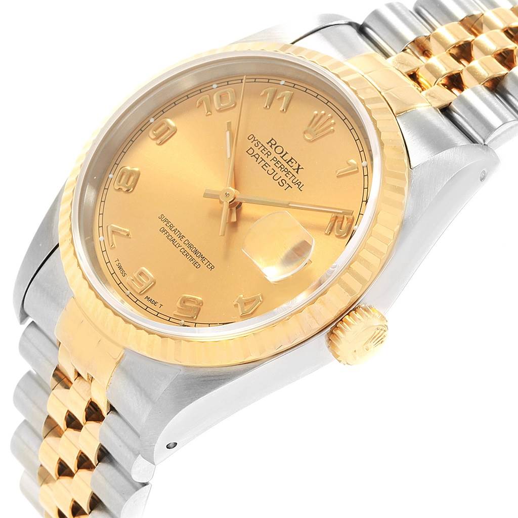 The Rolex Datejust 16233 Men's Steel and Gold (two tone) Champagne Dial 16233 Men's Steel and Gold (two tone) Champagne Dial watch is shown at an angled close-up, displaying the face, crown, bezel, and a partial view of the bracelet.