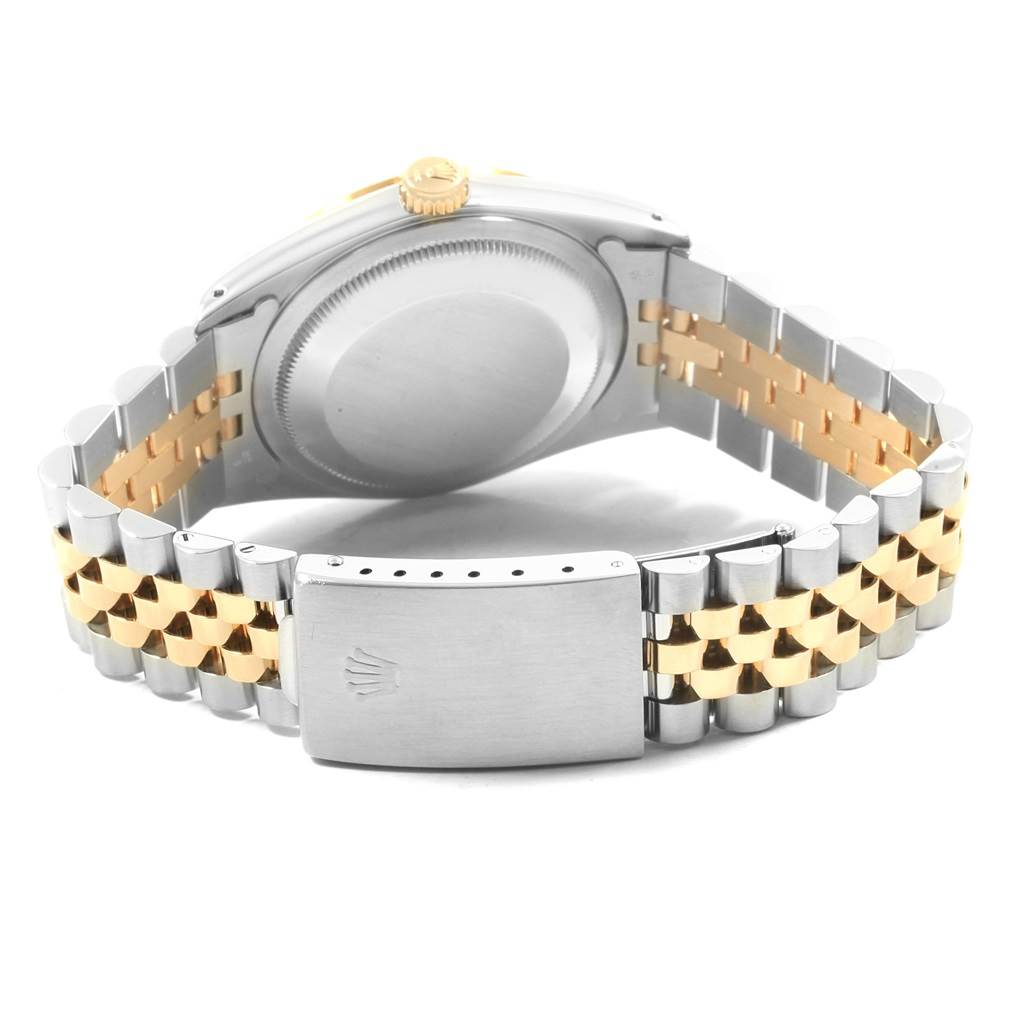 The image shows the back view of a Rolex Datejust 16233 Men's Steel and Gold (two tone) Champagne Dial 16233 Men's Steel and Gold (two tone) Champagne Dial watch, highlighting its case back and Jubilee bracelet clasp.