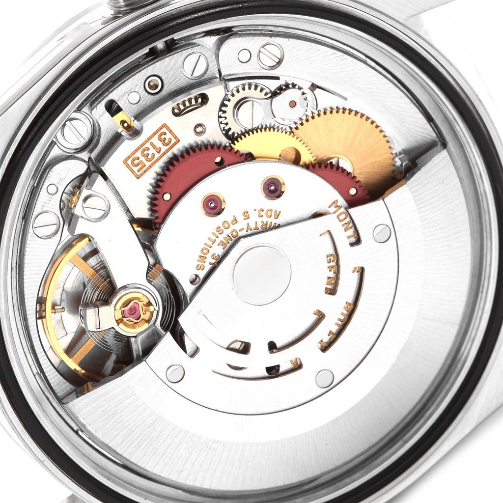 This image showcases the internal movement mechanism of a Rolex Datejust 16220 Men
s Stainless Steel Silver Dial 16220 Men
s Stainless Steel Silver Dial watch from a rear angle, highlighting gears and components.