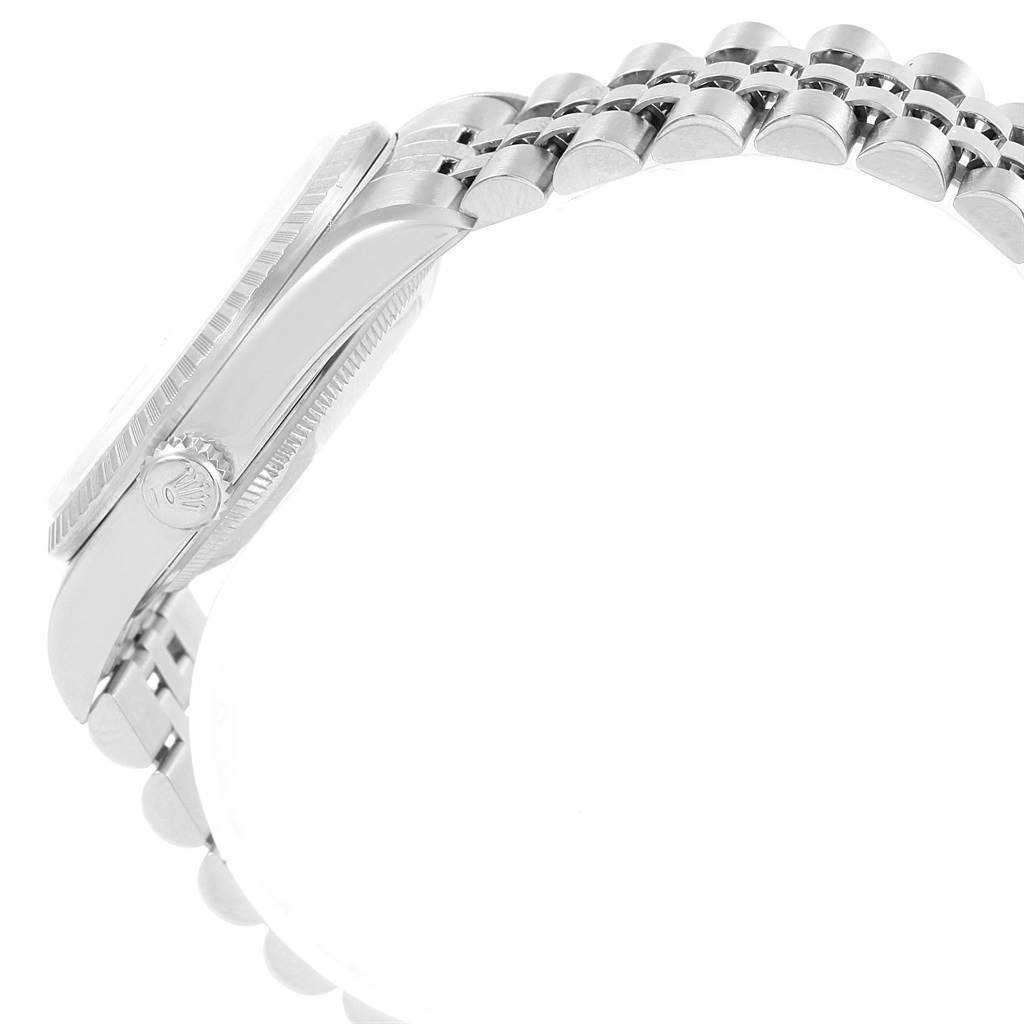 The image shows a side angle of the Rolex Datejust 16220 Men
s Stainless Steel Silver Dial 16220 Men
s Stainless Steel Silver Dial watch, focusing on the case, crown, bezel, and part of the bracelet.