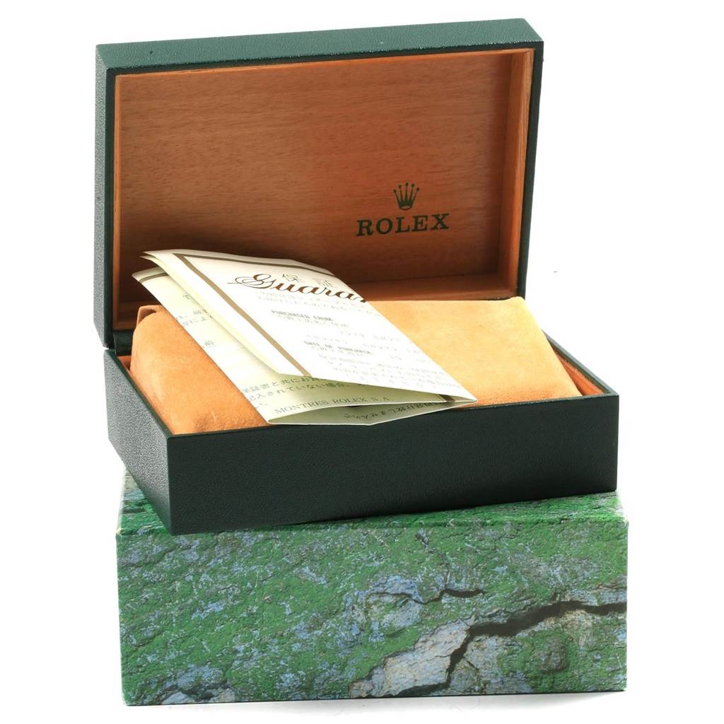 The image shows the open box of a Rolex Datejust 16220 Men
s Stainless Steel Silver Dial 16220 Men
s Stainless Steel Silver Dial watch, containing documents and protective covers.