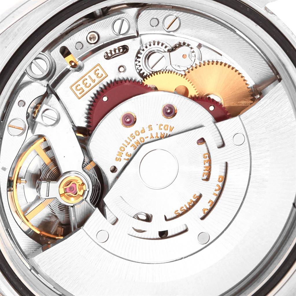 This image shows the inner mechanism of a Rolex Datejust 116244 Men
s Stainless Steel Mother of Pearl Dial 116244 Men
s Stainless Steel Mother of Pearl Dial watch, focusing on the intricate gears and components.