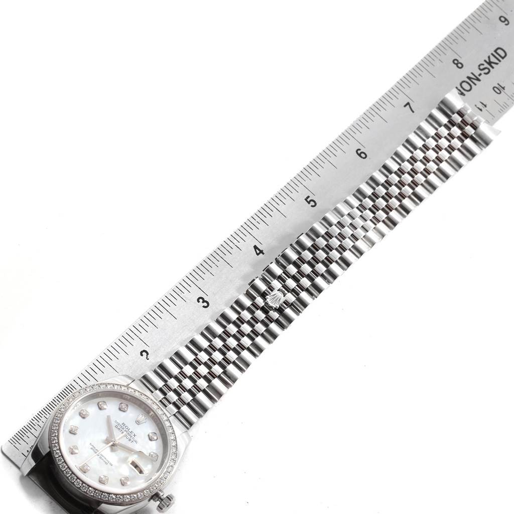 The image shows the face and bracelet of a Rolex Datejust 116244 Men
s Stainless Steel Mother of Pearl Dial 116244 Men
s Stainless Steel Mother of Pearl Dial watch, measured alongside a ruler.
