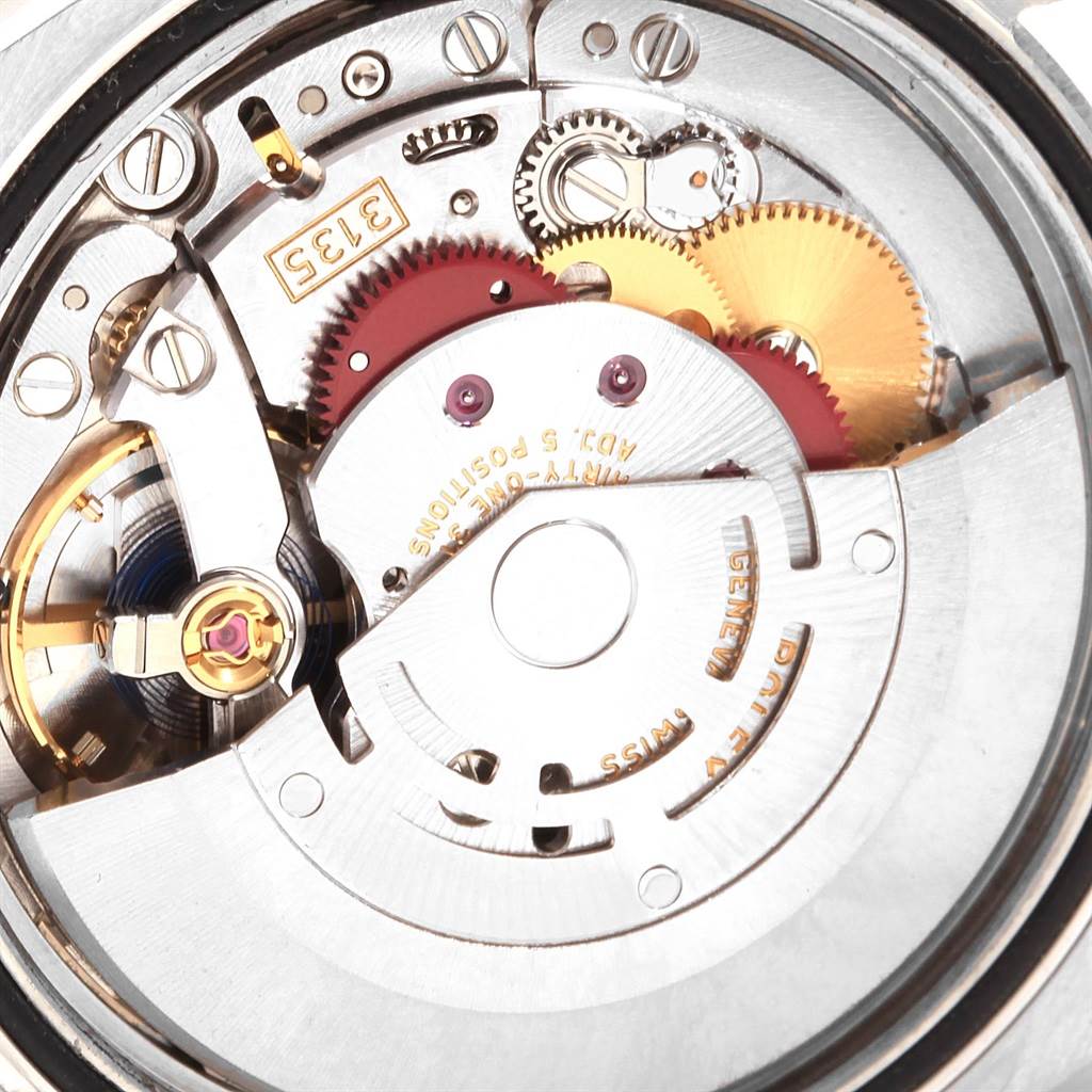The image shows a close-up of the inner mechanical movement of a Rolex Datejust 116243 Men's Stainless Steel Silver Dial 116243 Men's Stainless Steel Silver Dial watch.