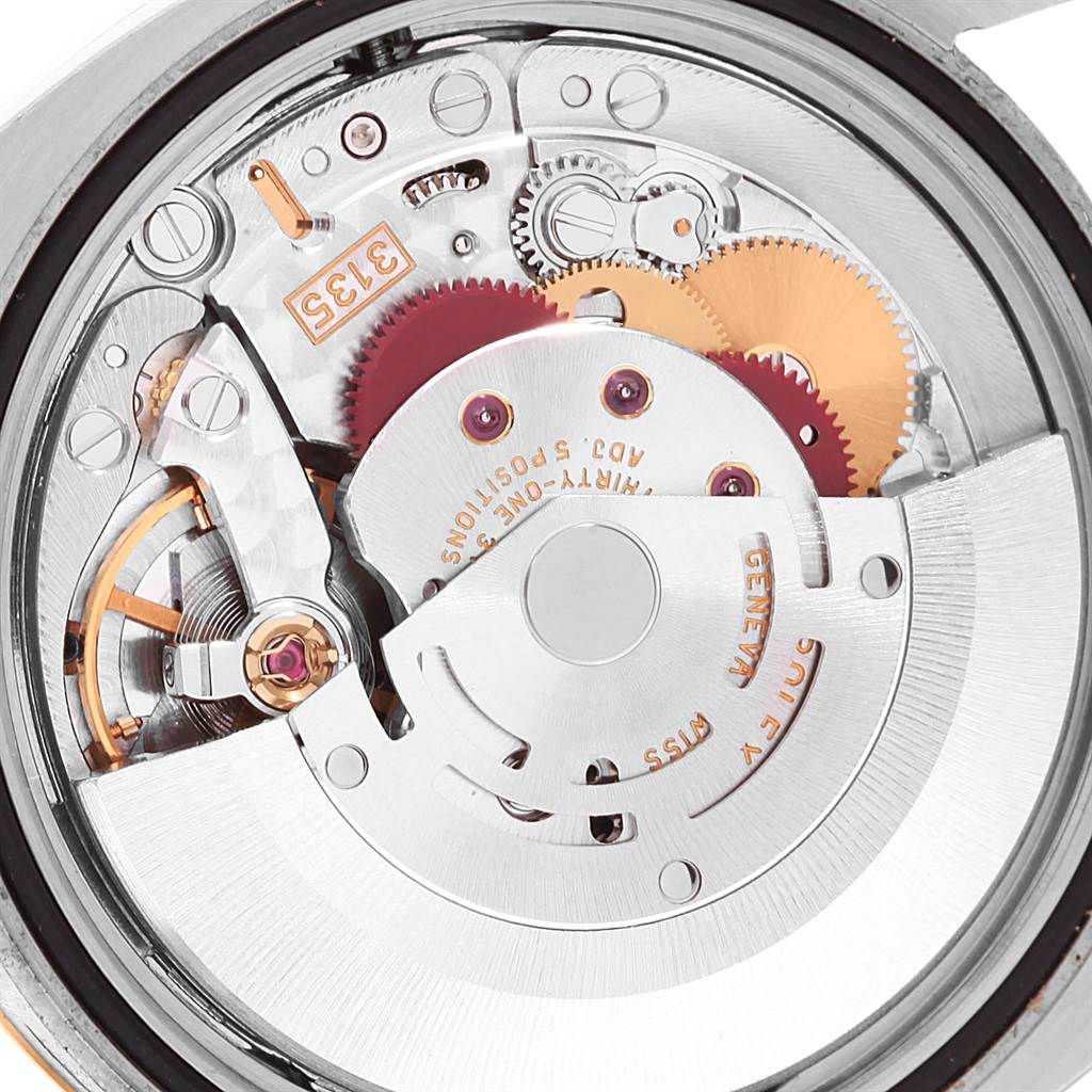 The image shows the intricate movement mechanism of a Rolex Datejust 116233 Men's Stainless Steel Black Dial 116233 Men's Stainless Steel Black Dial watch from a top-down angle.