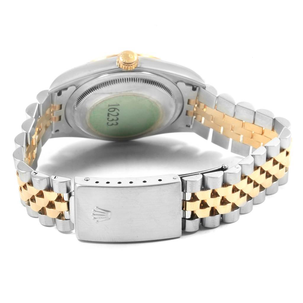 The image shows the back view and clasp of a Rolex Datejust 16233 Men
s Steel and Gold (two tone) White Dial 16233 Men
s Steel and Gold (two tone) White Dial watch, revealing the two-tone bracelet and case back.