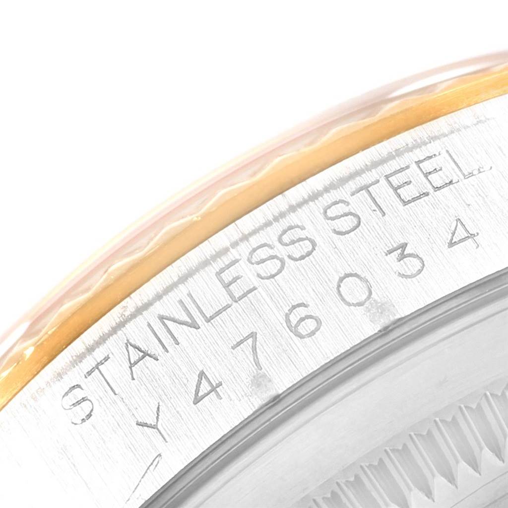This close-up shows the side of the bezel and serial number engraving on a Rolex Datejust 16233 Men
s Steel and Gold (two tone) White Dial 16233 Men
s Steel and Gold (two tone) White Dial model.