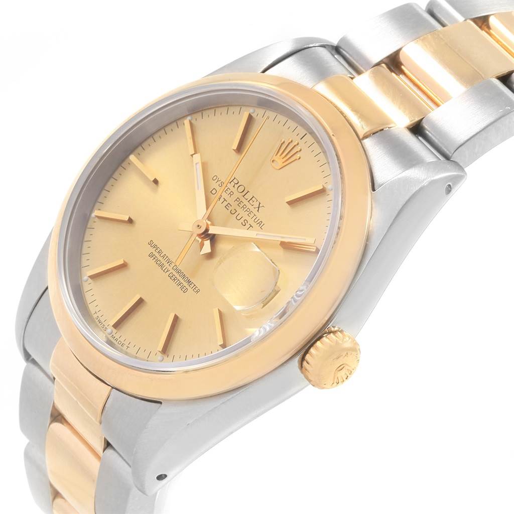 The image shows a Rolex Datejust 19885 Men's Steel and Gold (two tone) Champagne Dial 19885 Men's Steel and Gold (two tone) Champagne Dial watch viewed at an angle highlighting the face, bezel, crown, and bracelet.