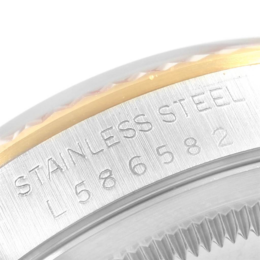 This close-up angle shows the engraved serial number and "Stainless Steel" marking on the Rolex Datejust 16233 Men's Steel and Gold (two tone) Beige Dial 16233 Men's Steel and Gold (two tone) Beige Dial model.