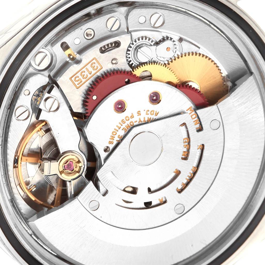 This image shows a close-up of the movement mechanism from the back of a Rolex Datejust 16220 Men
s Stainless Steel Silver Dial 16220 Men
s Stainless Steel Silver Dial watch.