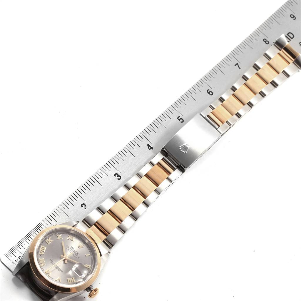 The image shows a Rolex Datejust 16203 Men's Steel and Gold (two tone) Grey Dial 16203 Men's Steel and Gold (two tone) Grey Dial watch laid flat on a ruler, focusing on its face, bracelet, and clasp.