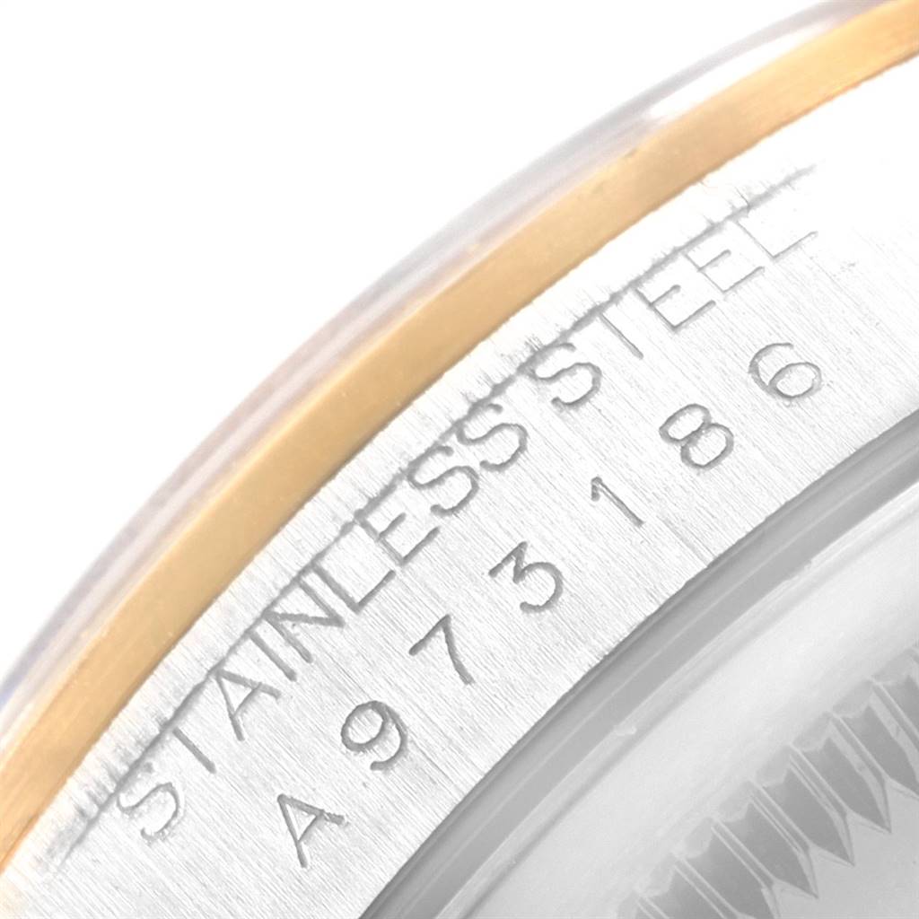 This close-up image shows part of the stainless steel bezel with engravings on the Rolex Datejust 16203 Men's Steel and Gold (two tone) Grey Dial 16203 Men's Steel and Gold (two tone) Grey Dial watch.