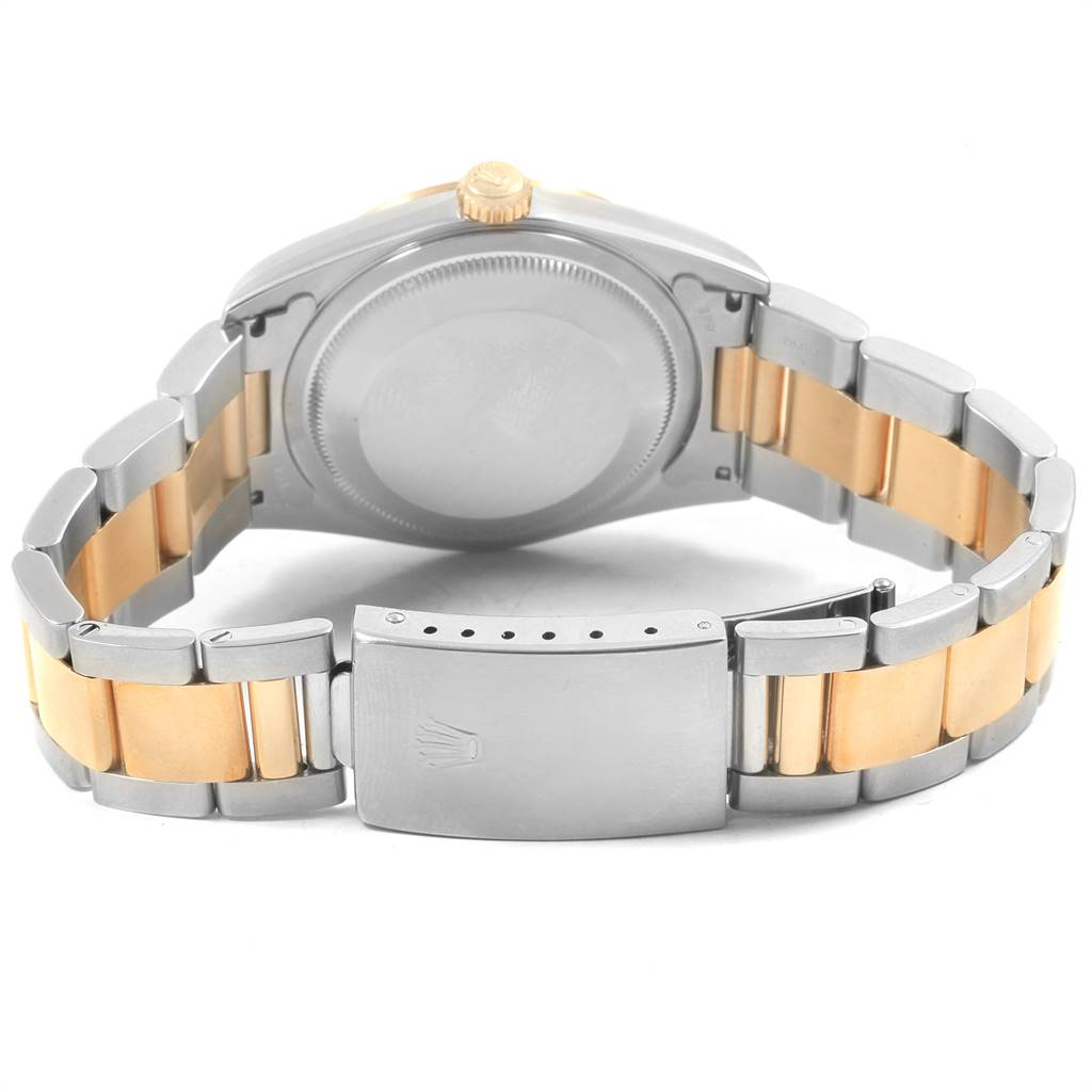 The image shows the back of the Rolex Datejust 16203 Men's Steel and Gold (two tone) Grey Dial 16203 Men's Steel and Gold (two tone) Grey Dial watch case and the bracelet with its clasp.