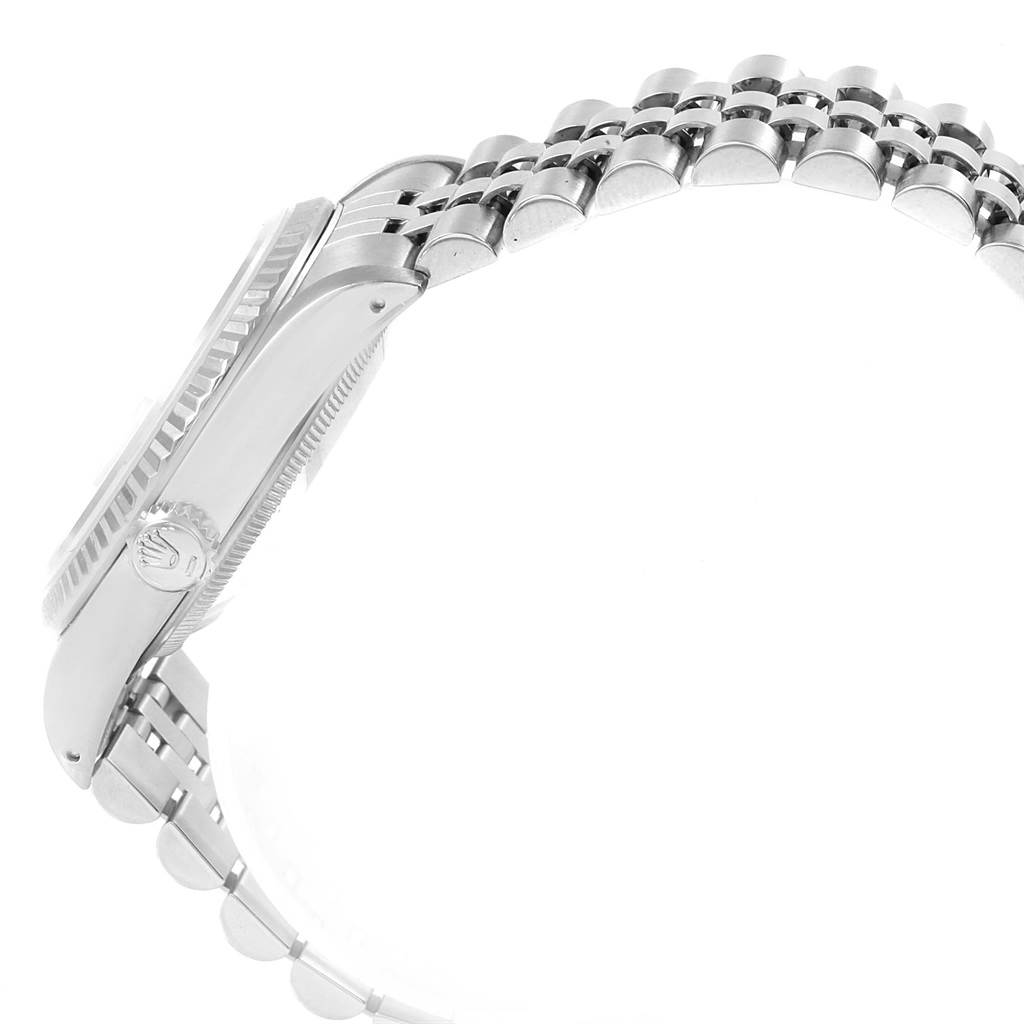 The image shows a side view of the Rolex Datejust 16234 Men's Stainless Steel Silver Dial 16234 Men's Stainless Steel Silver Dial watch, highlighting its crown, bezel, and part of the bracelet.