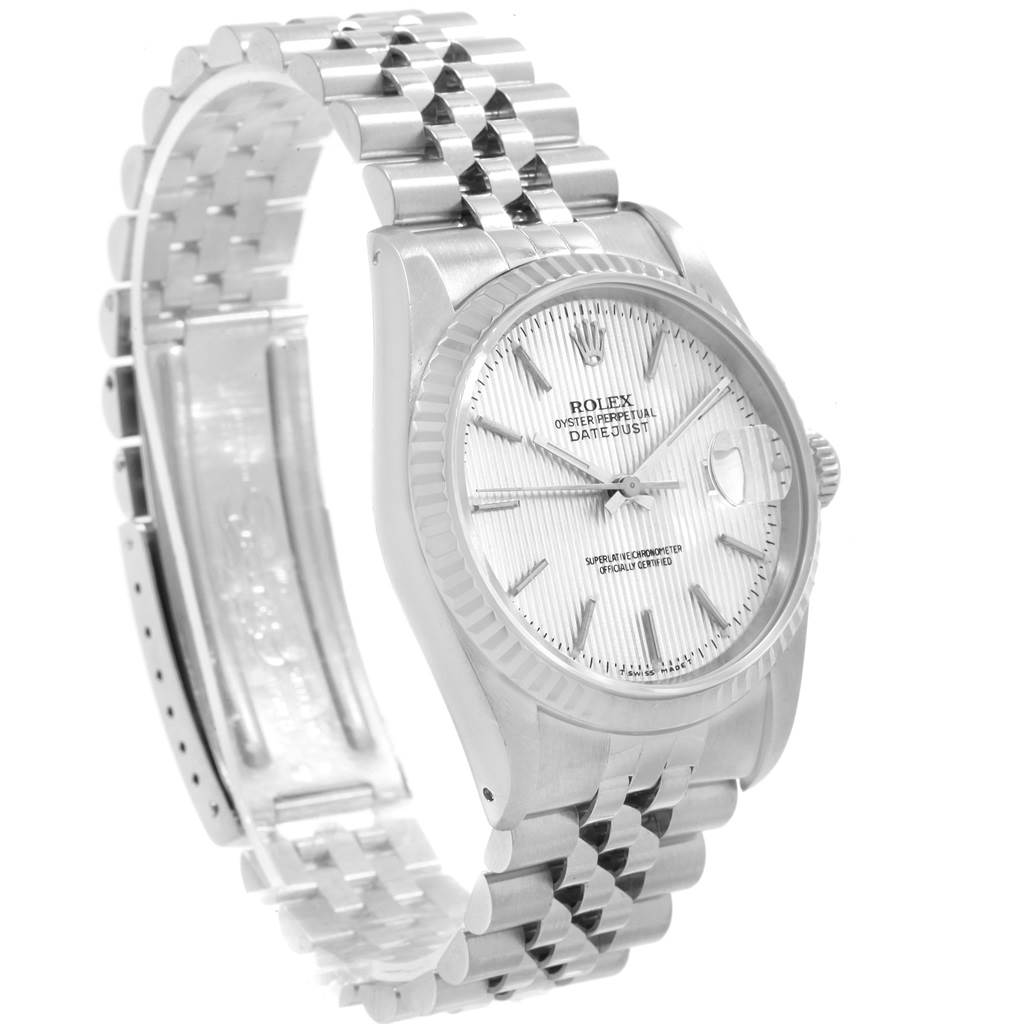 The image shows a side angle of a Rolex Datejust 16234 Men's Stainless Steel Silver Dial 16234 Men's Stainless Steel Silver Dial watch, highlighting its bracelet, case, dial, and fluted bezel.