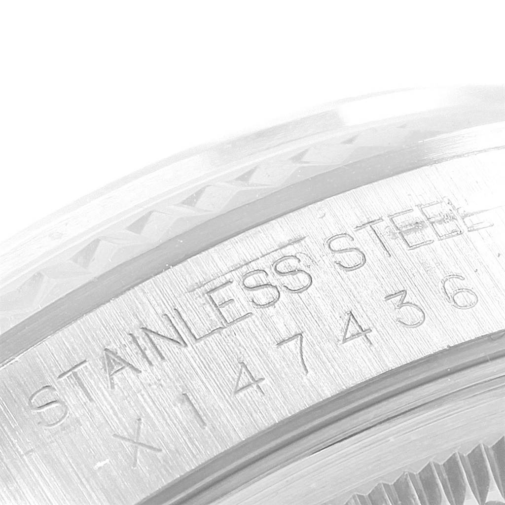 This close-up image shows the engraved details of the case back of a Rolex Datejust 16234 Men's Stainless Steel Silver Dial 16234 Men's Stainless Steel Silver Dial watch.