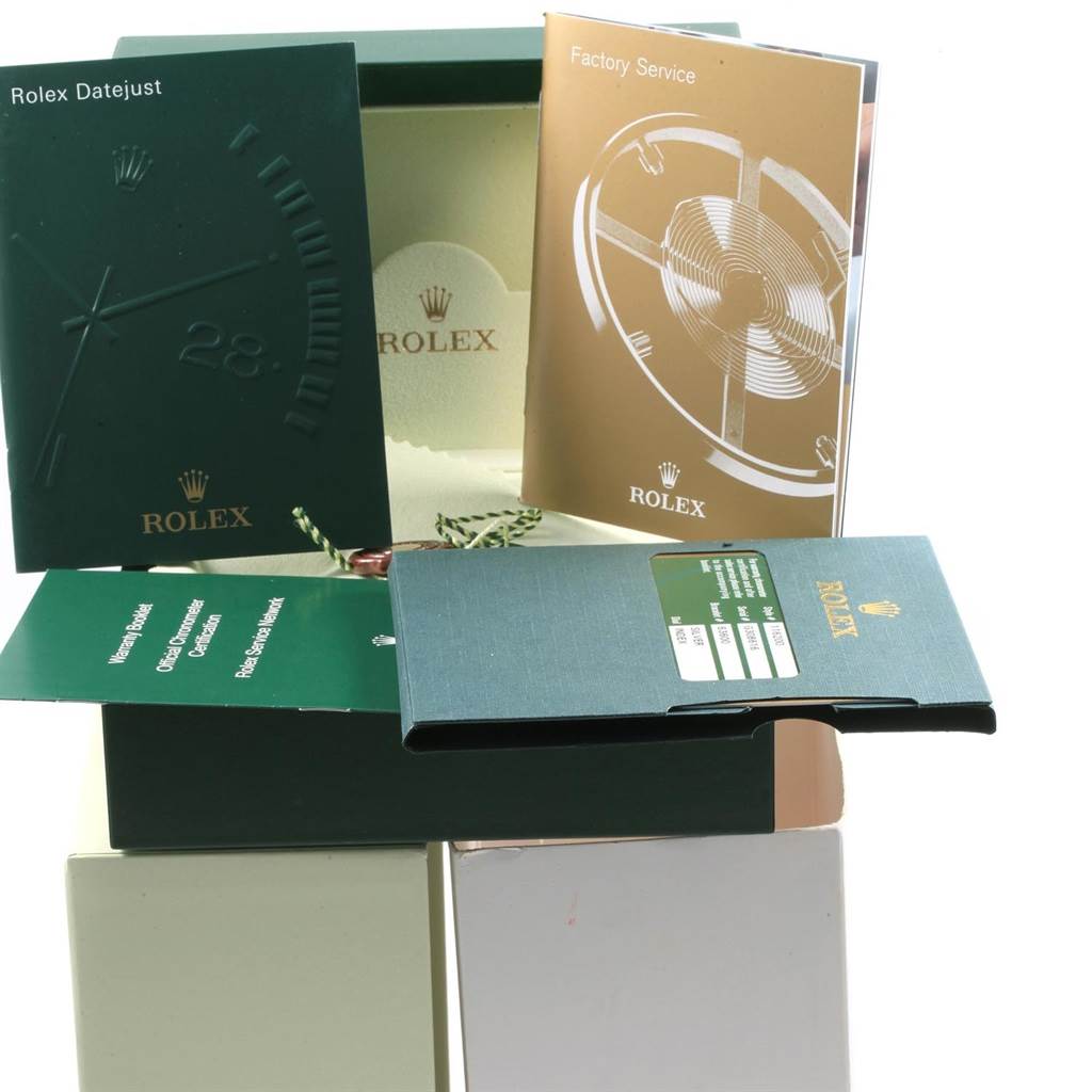 The image shows the packaging and documentation for a Rolex Datejust 116200 Men's Stainless Steel Silver Dial 116200 Men's Stainless Steel Silver Dial watch, including the warranty booklet and factory service manual.